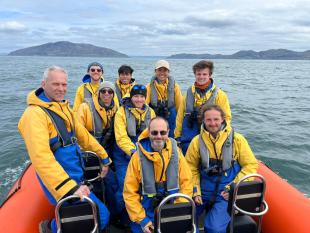 IDCORE Research Engineer - Mitch Shields with colleagues on a RIB at sea