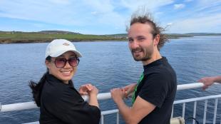 IDCORE Research Engineer - Tzu-Hsun Lin on a ferry with a colleague